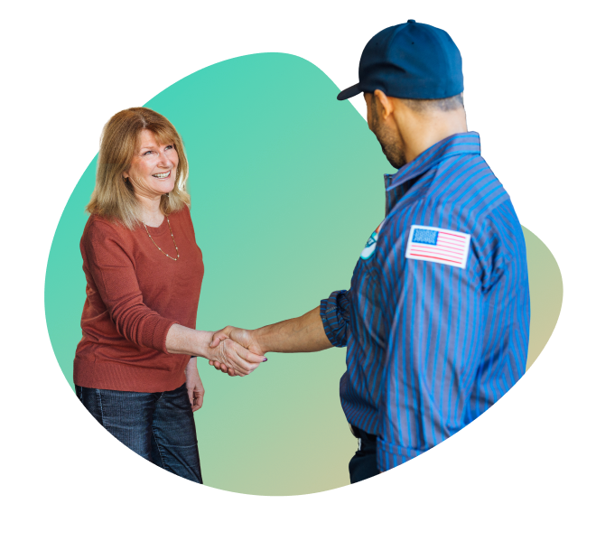A woman shakes hands with a man in a blue uniform and cap, set against a green gradient background, as they discuss a maintenance plan.